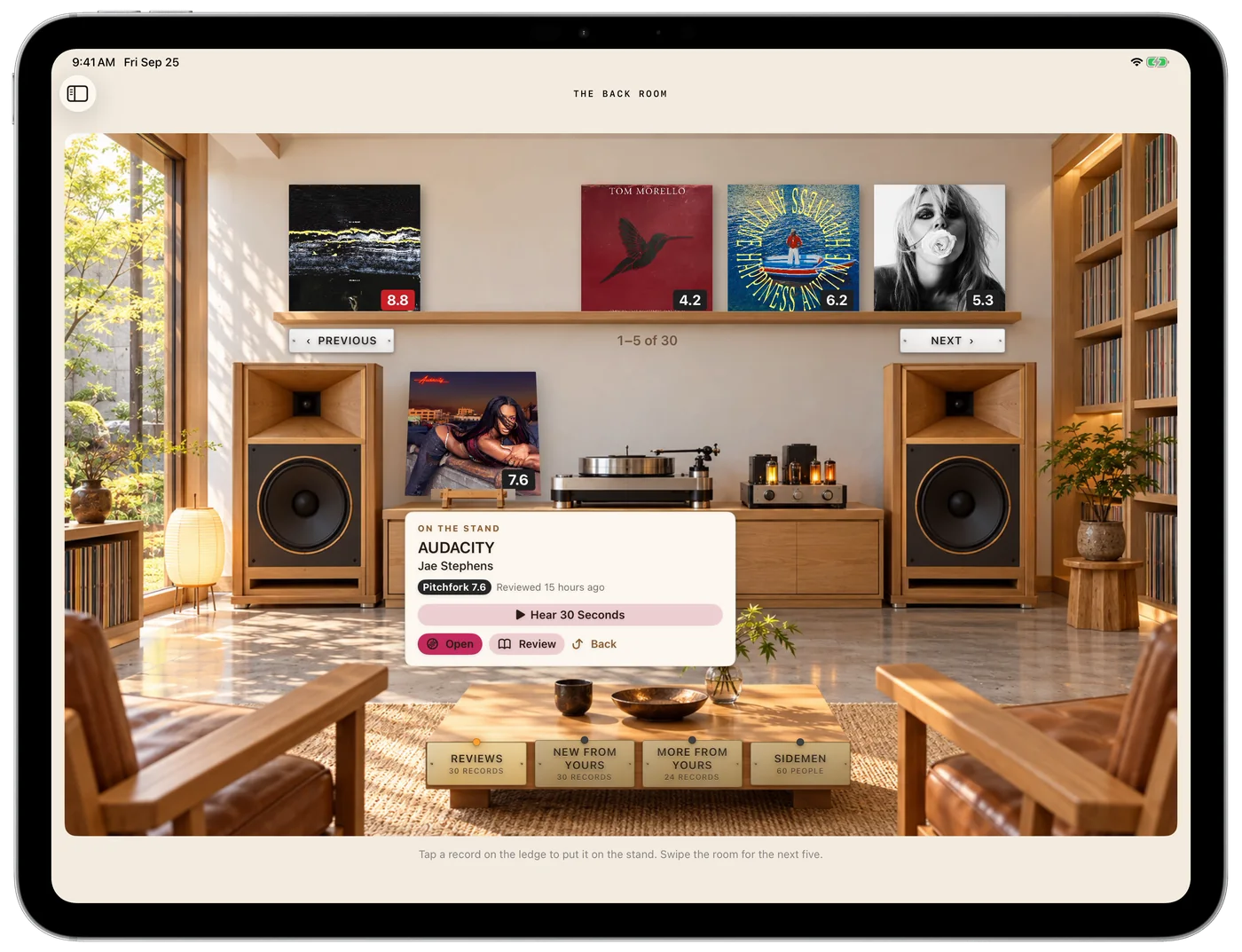 The Back Room on iPad in landscape: a record on the stand with its Pitchfork score, and the ledge of reviewed records above